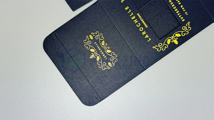 Black premium packaging with gold foil accents, featuring elegant typography and decorative flourishes