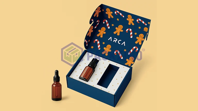 Blue festive skincare box with dropper bottle insert