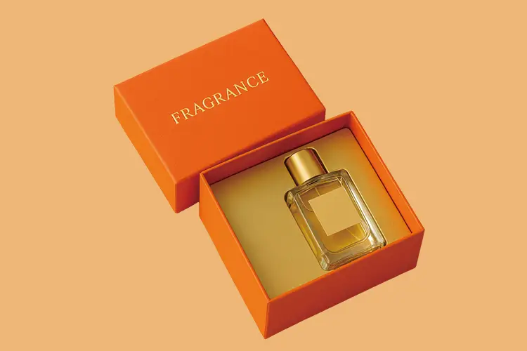 Rigid box for perfume with elegant gold foil logo, showcasing a premium fragrance bottle in an orange two-piece setup.