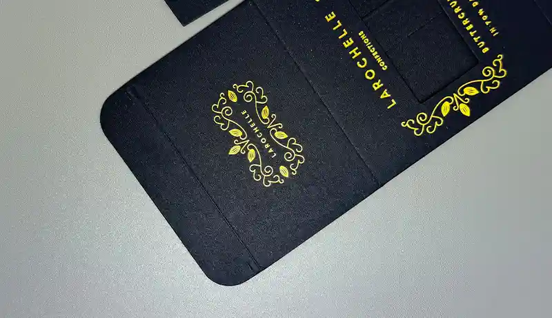 Black paperboard sheet with elegant matte surface used in luxury packaging