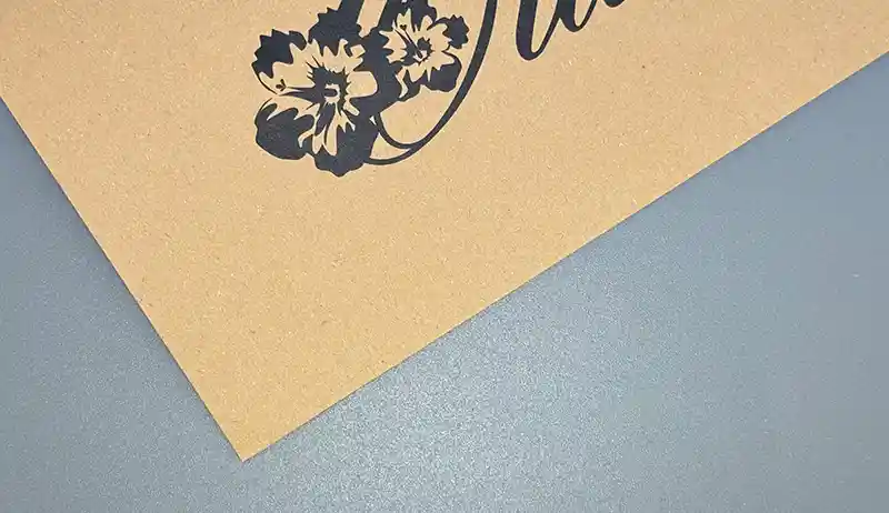 Kraft paper sheet printed with floral artwork in black ink