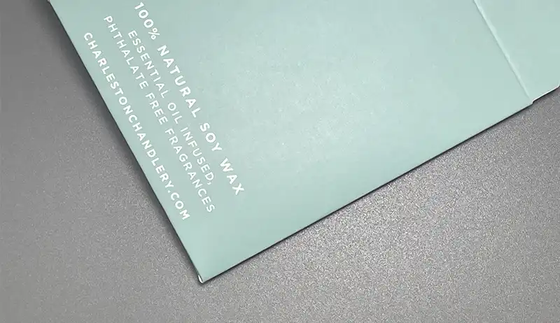 Anti-scratch matte lamination finish on green folding carton.