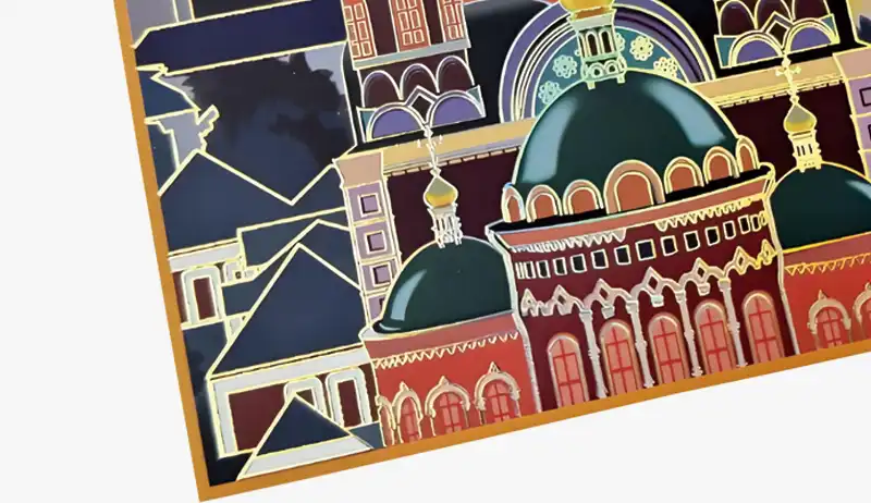 Gold and colored foil stamping featuring architectural patterns on box