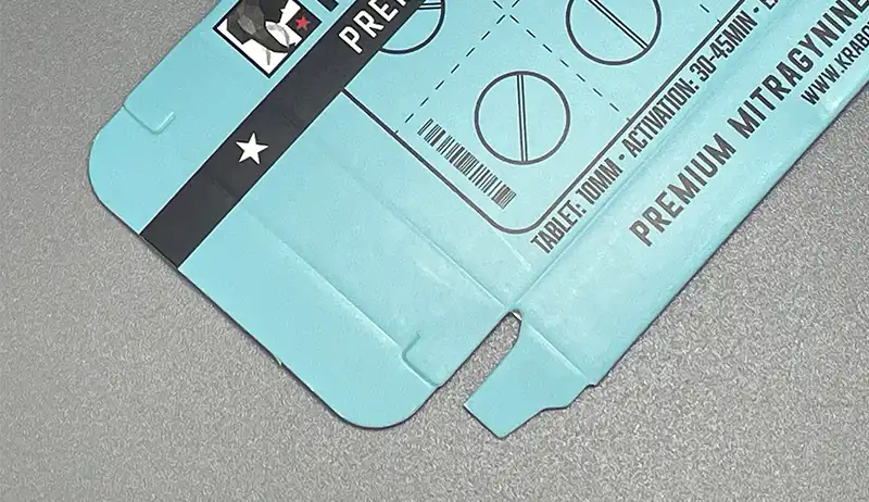 Water-based matte AQ coating on light blue printed folding carton.