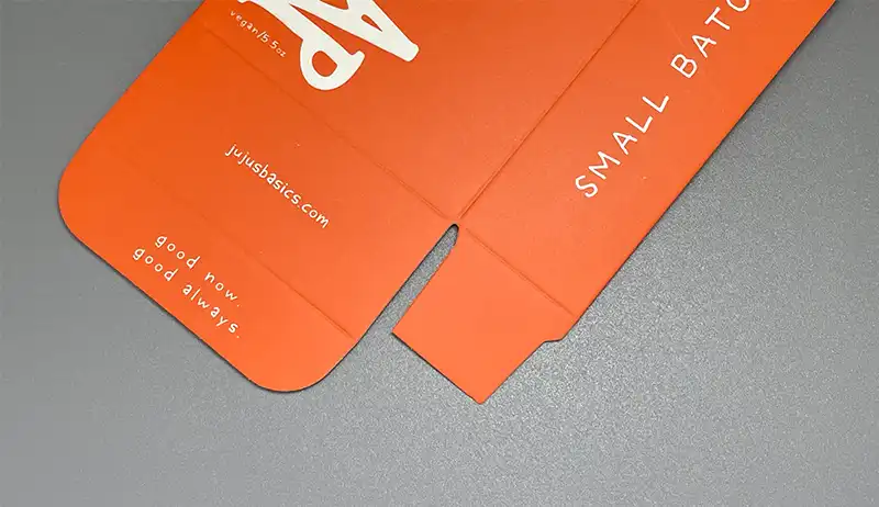 Smooth matte lamination on red custom printed folding carton.