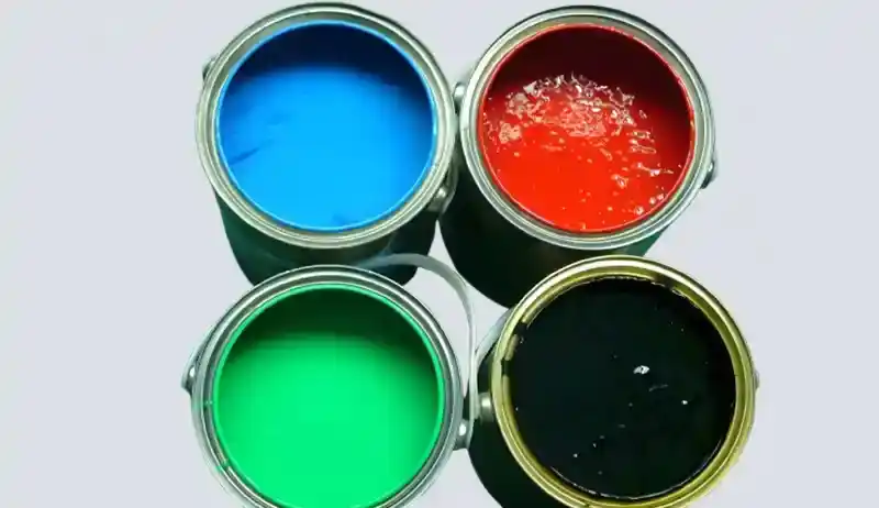 Oil-based printing inks in cyan, magenta, yellow, and black containers