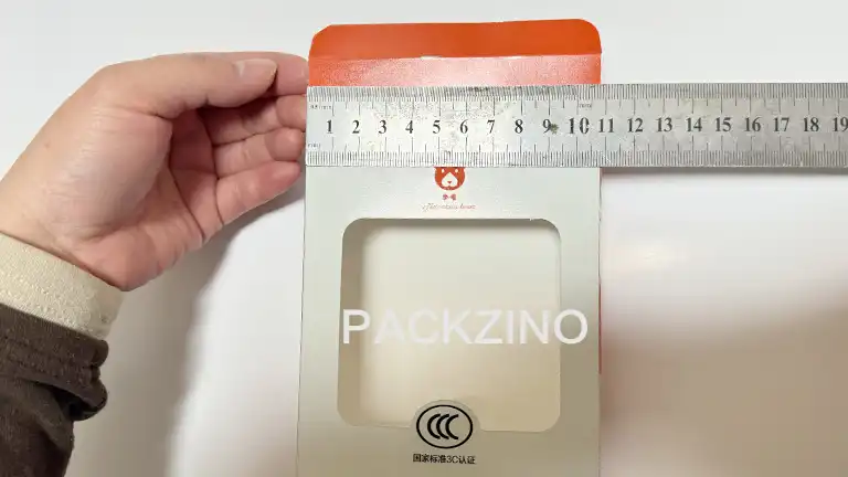 Measuring foldable carton with a ruler for precise packaging dimensions