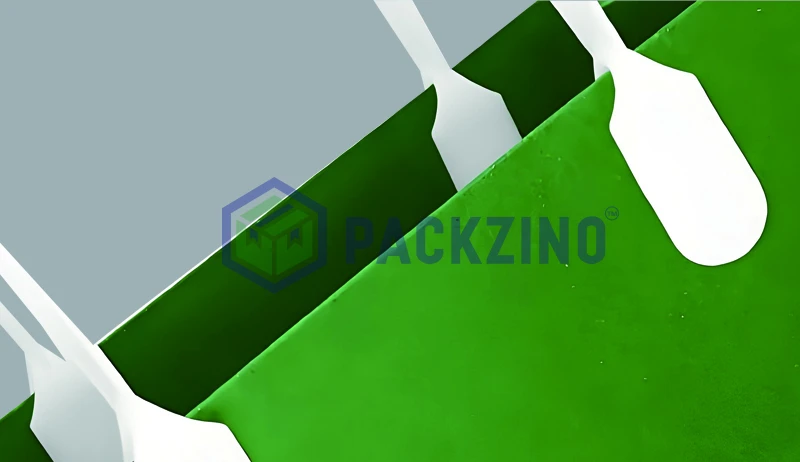 Green paper bag with embedded white flat plastic handles