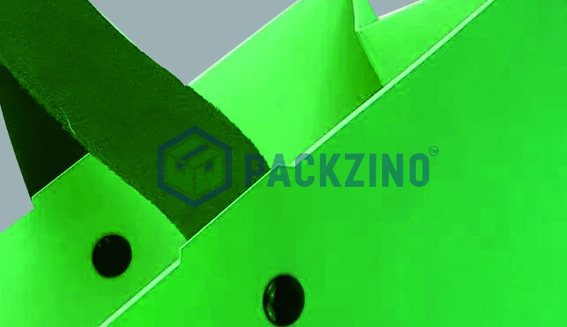 Green bag with rope handle fixed using black rivets