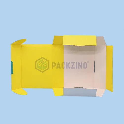 Unfolded yellow corrugated box with roll end tuck front closure