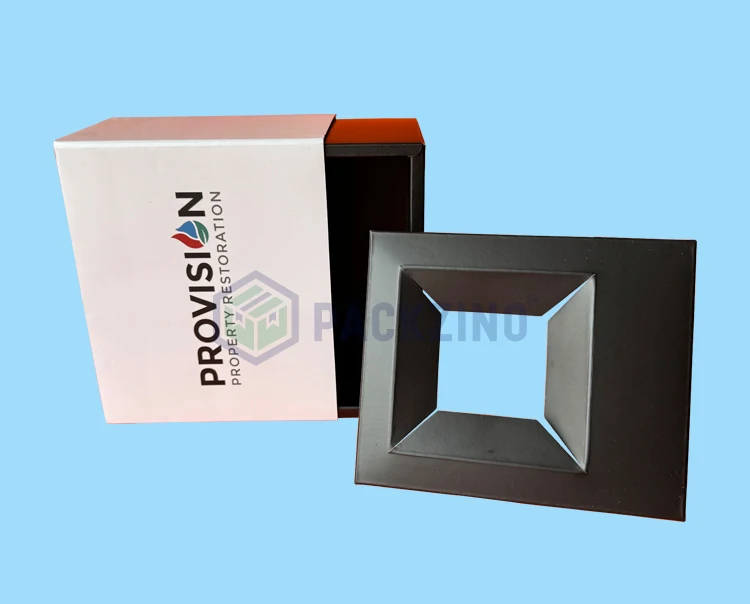 Eco-friendly corrugated insert with die-cut window fits snugly in a custom drawer rigid box.