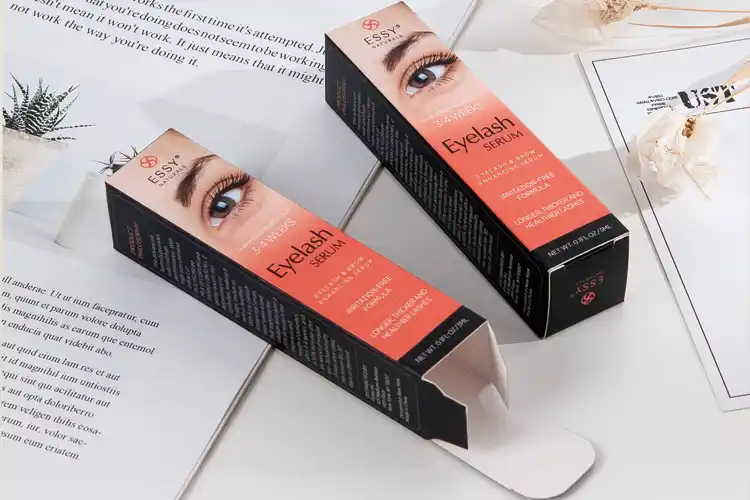 Custom printed eyelash serum boxes with gradient design, ideal for retail cosmetic packaging.