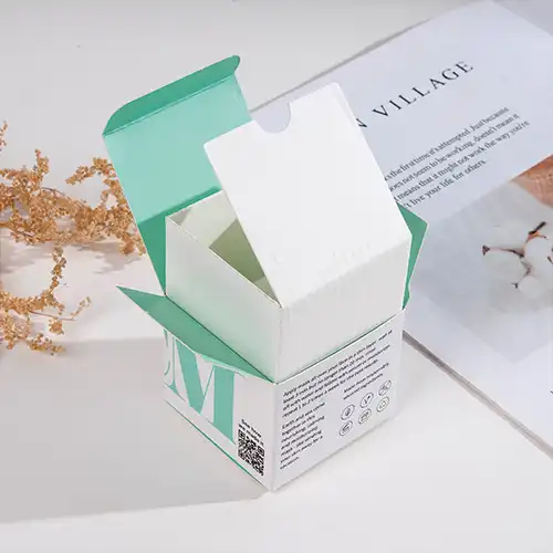 Custom corrugated paper insert holds skincare bottle securely inside a printed cosmetic box.