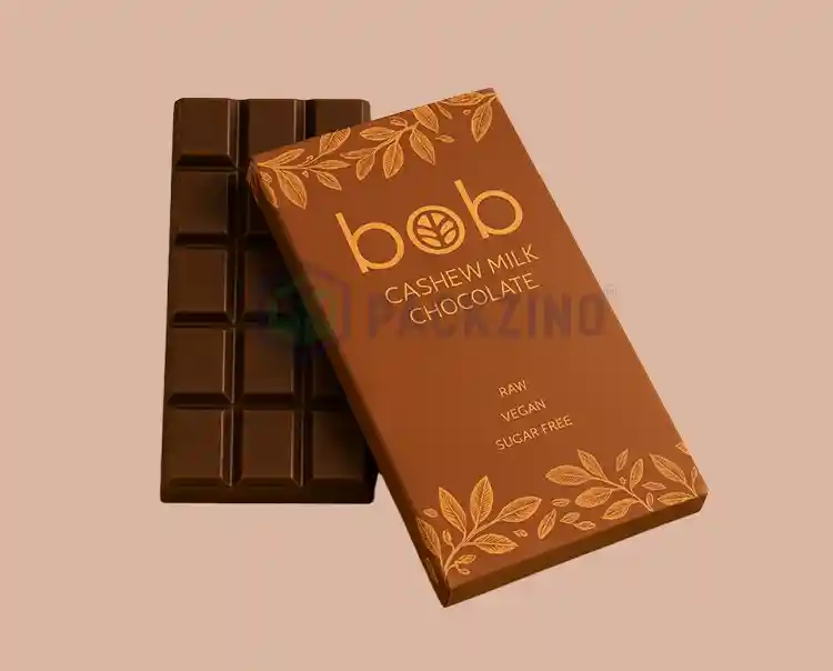 Custom printed chocolate box with gold foil logo and botanical design for vegan chocolate bar.