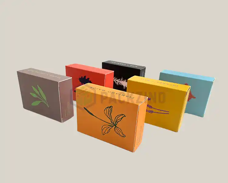 Custom printed folding cartons for skincare products in assorted colors and botanical illustrations