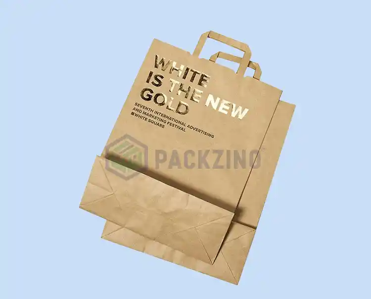 Custom printed kraft paper bag with gold foil text and flat handles on blue background