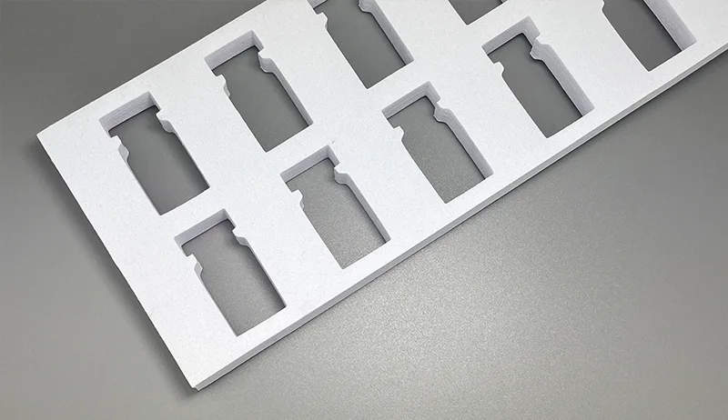 Die-cut EVA foam insert for cosmetic rigid boxes with snug-fit structure.