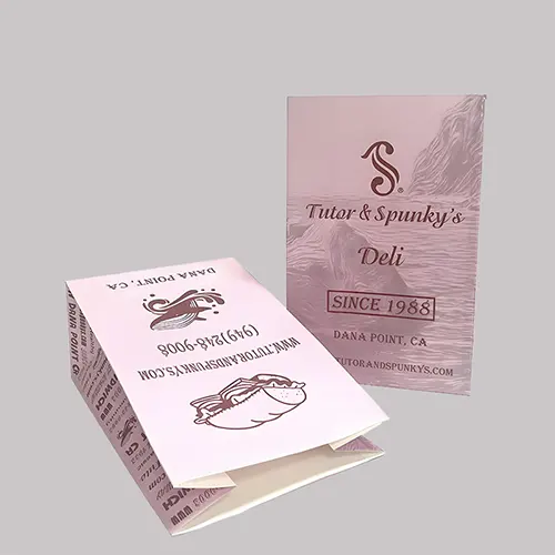 Eco-friendly paper bag with custom deli print, ideal for takeout and food service use.