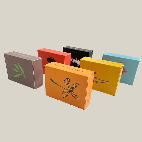 A collection of colorful folding carton boxes with floral illustrations