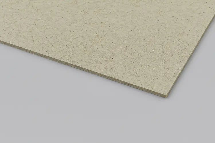 Durable grey chipboard used as the inner core for rigid box packaging.