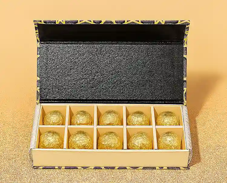 Luxury chocolate gift box with gold foil-wrapped truffles and 10-slot insert tray.