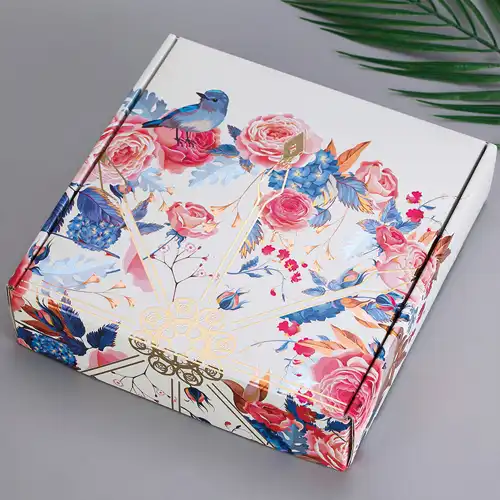 A luxury custom printed corrugated box with floral and bird illustrations