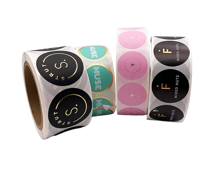 Round custom print labels in rolls with various branding colors and finishes