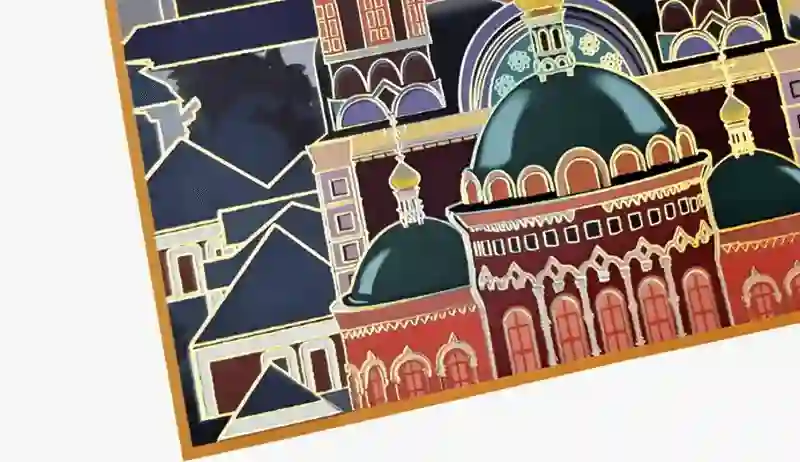 Gold and colored foil stamping featuring architectural patterns on box