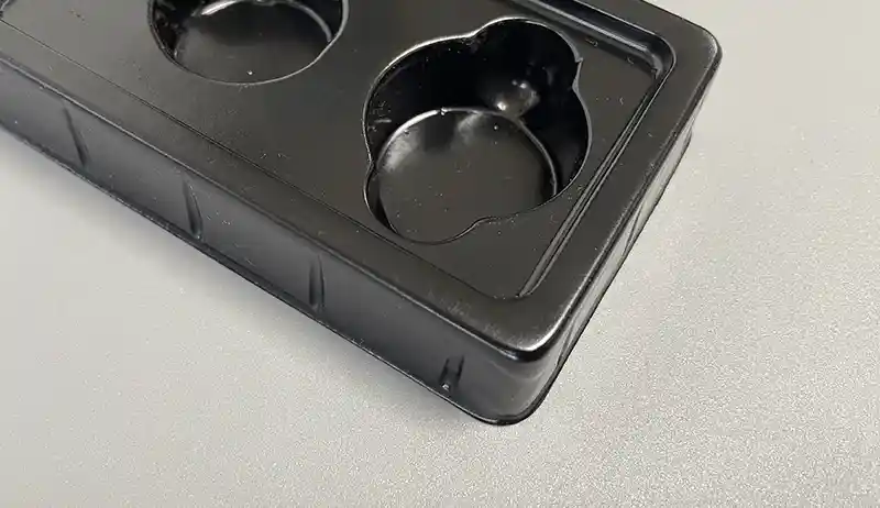 Custom black PE insert for product protection and display by Packzino.