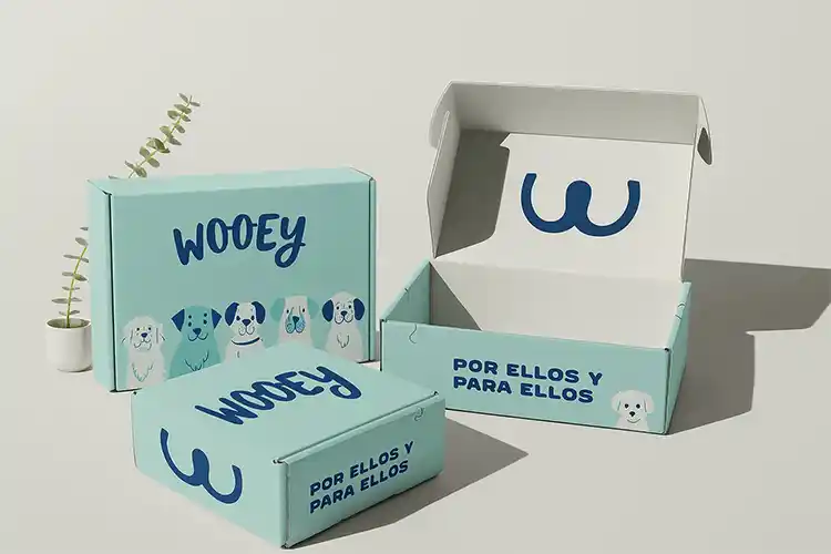 Custom corrugated pet shipping boxes in blue with dog illustrations