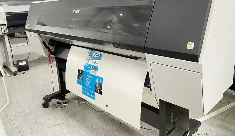 Epson large-format digital printing machine printing a color sheet