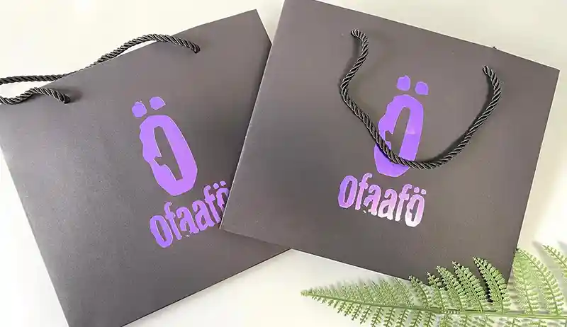 Gold foil stamping detail on custom clothing packaging box