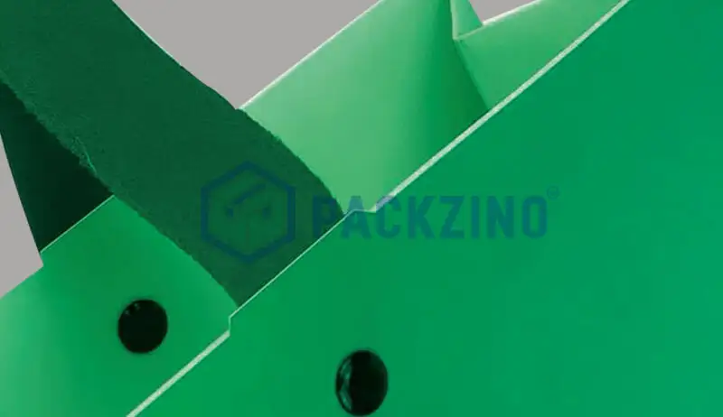 Green bag with rope handle fixed using black rivets