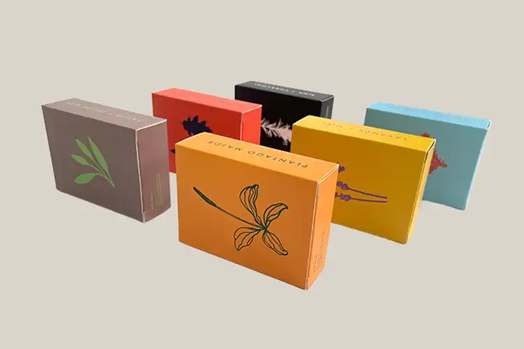 Colorful custom folding carton packaging boxes with floral design prints, used for skincare and food products – Packzino