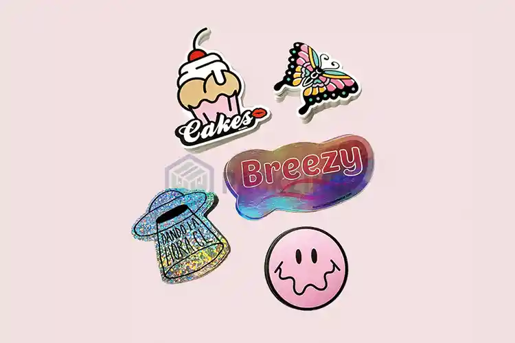 Custom die-cut label shapes including cupcake, butterfly, logo, and holographic designs