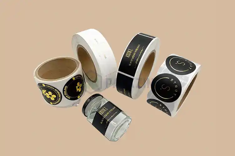 Custom printed labels applied on jars and rolls in black and gold design