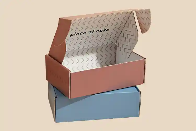 Set of pastel-colored corrugated mailer boxes for bakery and online store packaging.