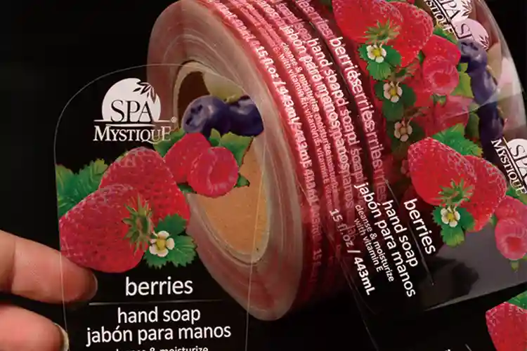 Clear film label roll showing vibrant printing quality and how film-based label materials perform on real production lines.